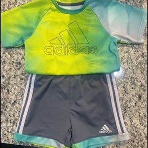 Adidas Set 2T. My son wore it 3x for gymnastics before outgrowing it.